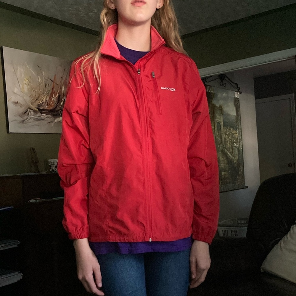 Saucony red vented elastic waist no hood running jacket.